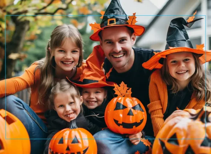 A parent and their children in Halloween Costumes